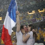 Fans of France kiss before their Group D Euro 2012 soccer match against Ukraine at Donbass Arena in Donetsk