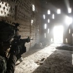 U.S. soldier points his rifle after coming under fire in Zharay district in Kandahar province, southern Afghanistan