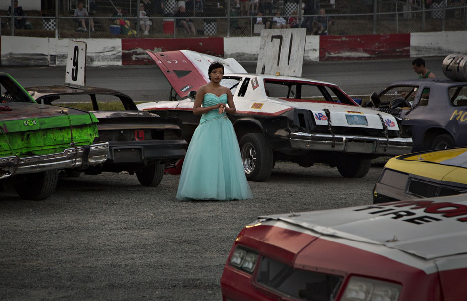 Dressed as a princess, Knoepfel stands in the pits waiting for the next race during the Saturday night stock car races at Agassiz Speedway in Agassiz