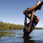 A Yawalapiti boy dips his head into the Xingu River in the Xingu National Park, Mato Grosso State