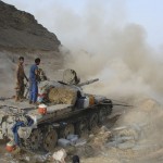 An army tank fires during a firefight against militants linked to al Qaeda near the southern Yemeni city of Zinjibar