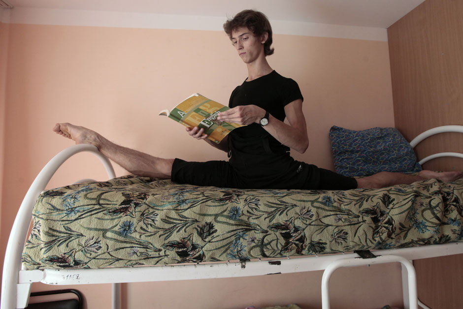 Kudryavtsev does leg-splits while reading a book in the Siberian city of Krasnoyarsk