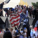 Protesters destroy American flag pulled down from US embassy in Cairo