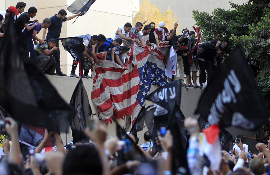 Protesters destroy American flag pulled down from US embassy in Cairo