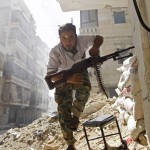 A Free Syrian Army fighter takes cover during clashes with Syrian Army in the Salaheddine neighbourhood of central Aleppo