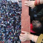 A child looks on as she observes the Bisket festival at the ancient city of Bhaktapur near Kathmandu