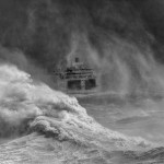 Ferry leaving Newhaven harbour in storm, East Sussex, England