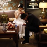A couple waits to participate in a staged mass wedding in Shanghai