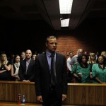 "Blade Runner" Oscar Pistorius awaits the start of court proceedings in the Pretoria Magistrates court