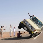 Saudi youths demonstrate a stunt known as "sidewall skiing" in the northern city of Hail