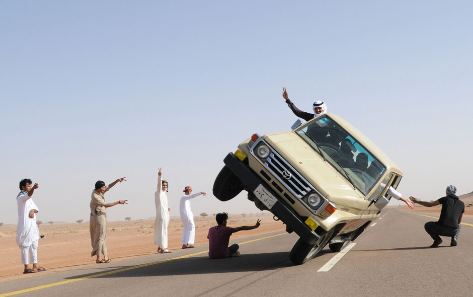Saudi youths demonstrate a stunt known as 