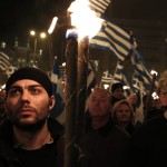 Supporters of the extreme-right Golden Dawn party hold torches during a gathering in Athens