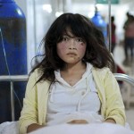 An injured woman receives treatment at a hospital after a 6.6 magnitude earthquake hit Minxian county, Dingxi