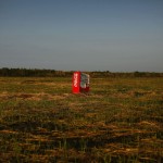 A vending machine, brought inland by a tsunami, is seen in a abandoned rice field inside the exclusion zone at the coastal area near Minamisoma in Fukushima prefecture