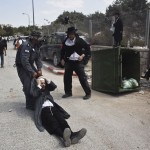 An Israeli policeman drags an ultra-Orthodox man during clashes in the town of Beit Shemesh