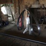 A worker carries a blade at a sawmill that processes trees illegally logged from the Amazon jungle near Morais Almeida