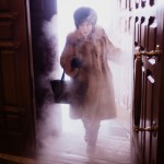 A local woman enters Preobrazhensky Cathedral in a swirl of freezing mist.