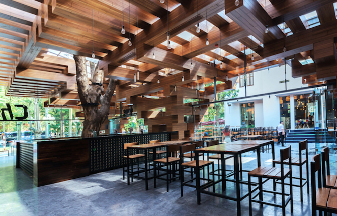 A Restaurant with Trees Inside in Hanoi