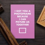 empty frames and old photo on the wooden table; Shutterstock ID 128619539