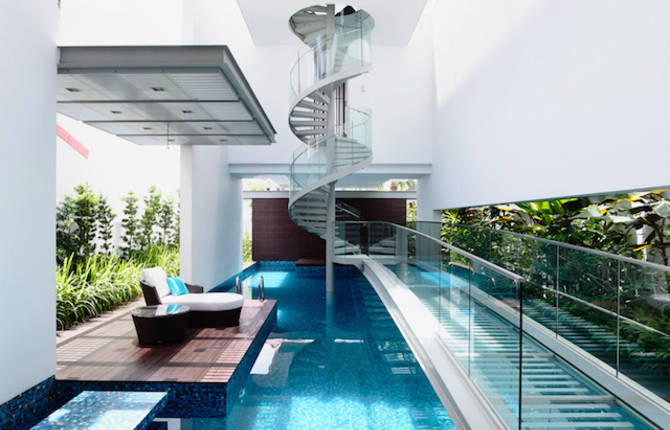 Spiral Staircase Above a Pool in a Singaporean Home