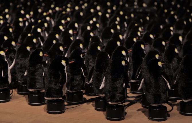 Interactive Mirror Built from 450 Rotating Penguins