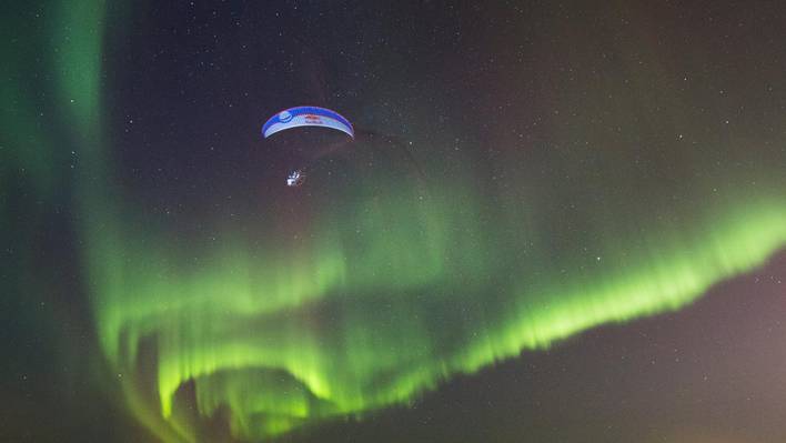Paragliding under Auroras Borealis