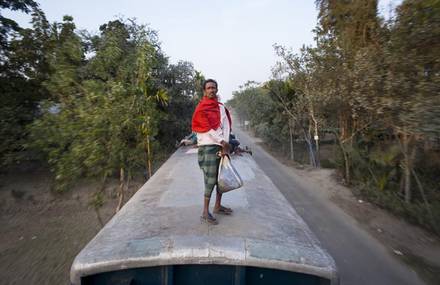 Dangerous Travel on Train Tops of Workers in Bangladesh