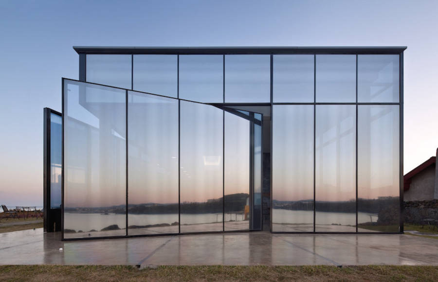 Cafe with Mirrored Facade & Pivoting Door in a Volcanic Island