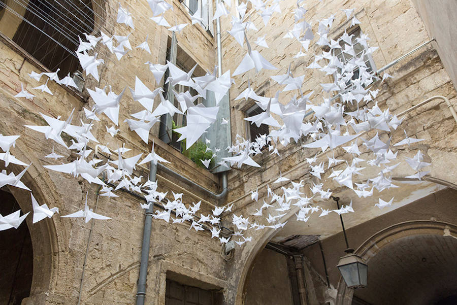 Suspended Origami Birds in a French Courtyard