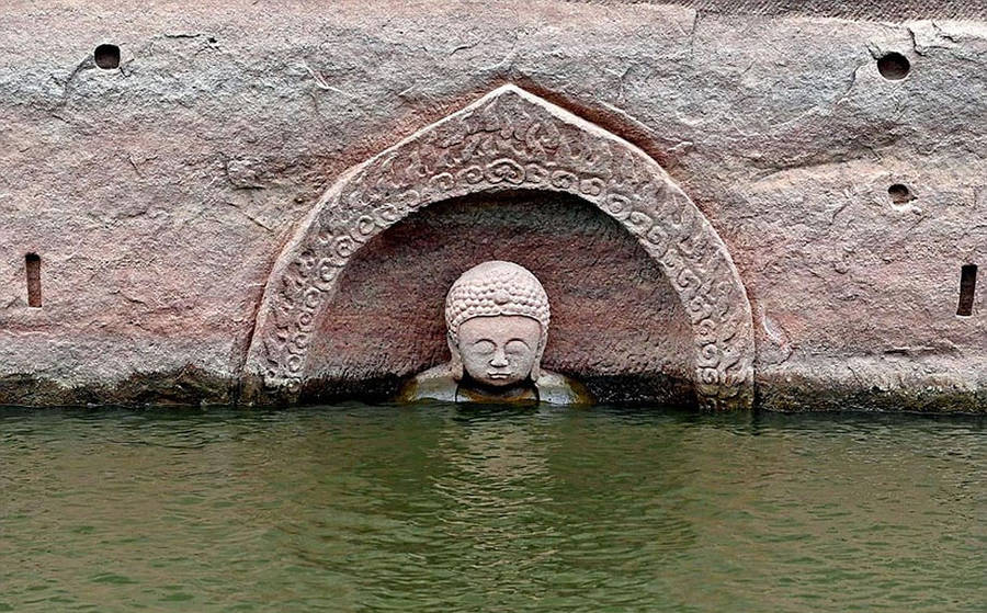 600-Year-Old Buddha Head Emerges From a Lake In China