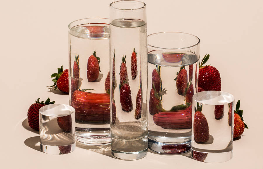 Distorted Fruit and Vegetables Through Water-Filled Glasses