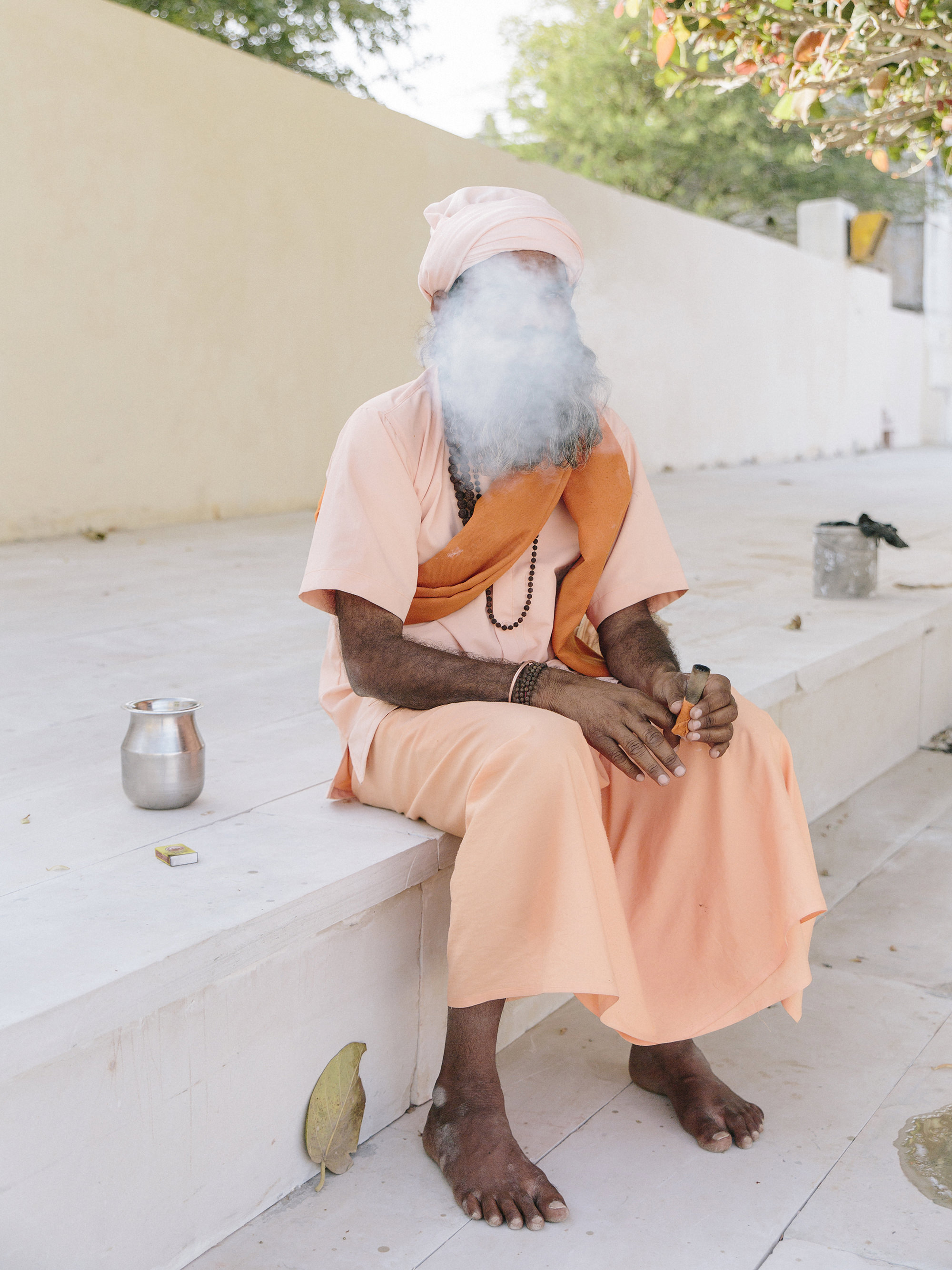 A sadhu smokes marijuana on a chillum (pipe). Pushkar, India. 2017.