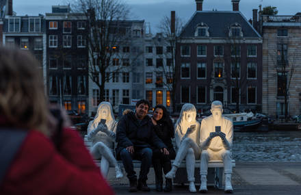 Screens Illuminate People in this Luminous Sculpture