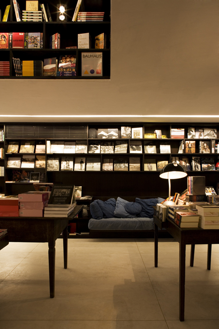 Tables and bookshelf in background