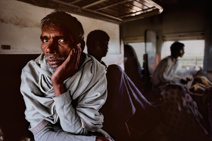 Men riding on a train to Peshawar, 1983, final book_iconic