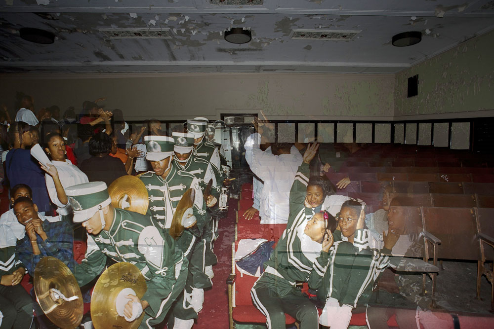 Pep band makes their way through a crowd.