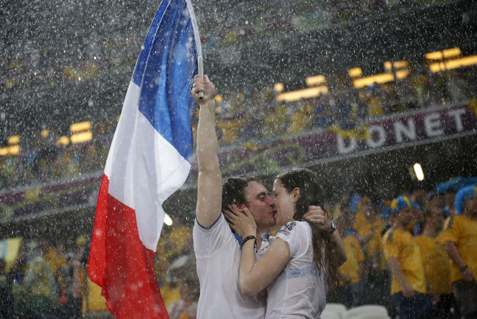 Fans of France kiss before their Group D Euro 2012 soccer match against Ukraine at Donbass Arena in Donetsk