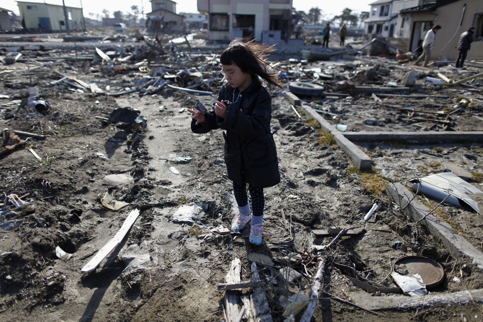 Kumaga visits the spot where her house, which was washed away by the March 11, 2011 tsunami, used to stand in Higashimatsushima