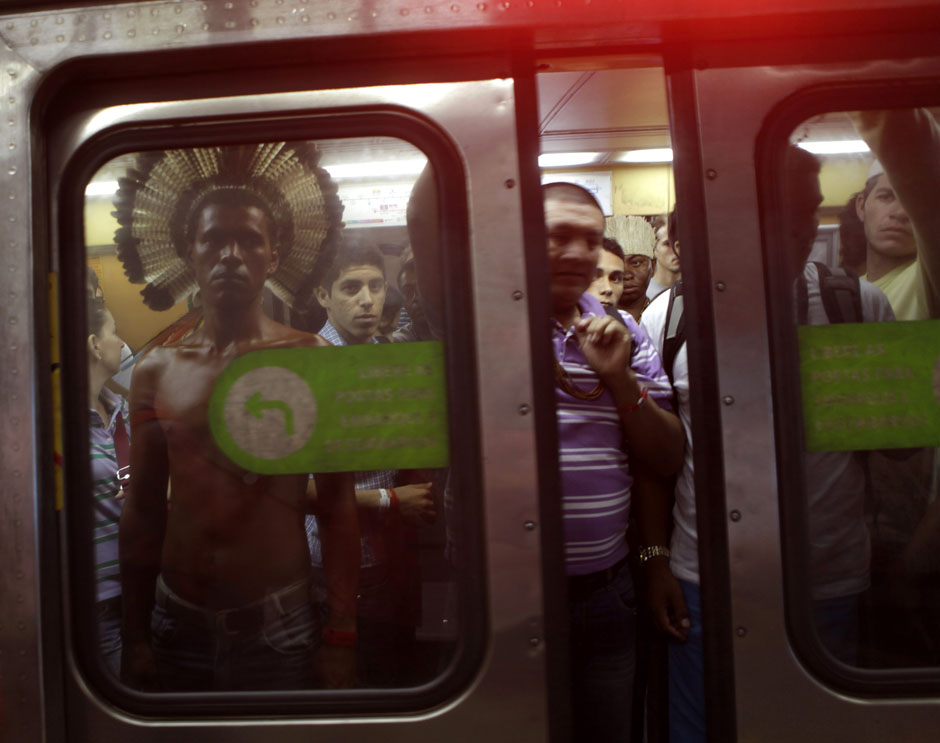 An indigenous man stands in a subway train as he makes his way to the People's Summit at Rio+20 for Social and Environmental Justice in Rio de Janeiro