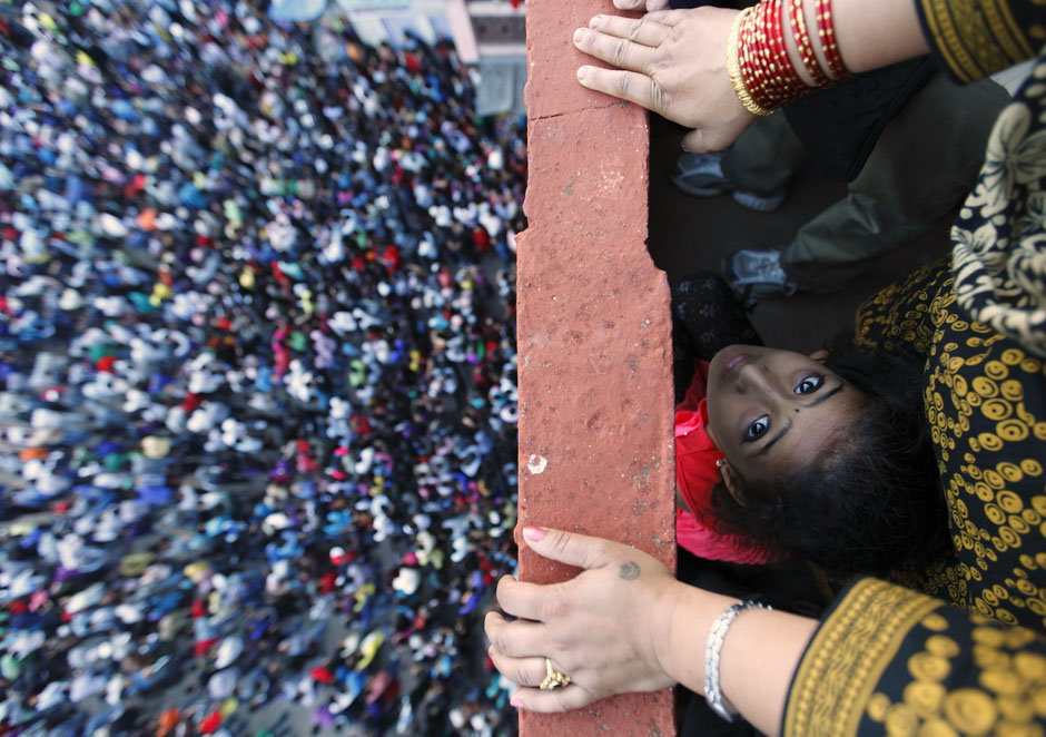 A child looks on as she observes the Bisket festival at the ancient city of Bhaktapur near Kathmandu