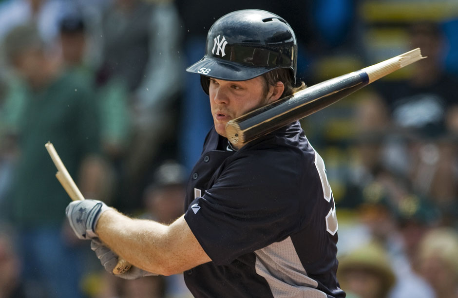 The barrel of Yankees' Boesch's broken bat smacks his face during their MLB spring training game against the Pirates in Bradenton, Florida