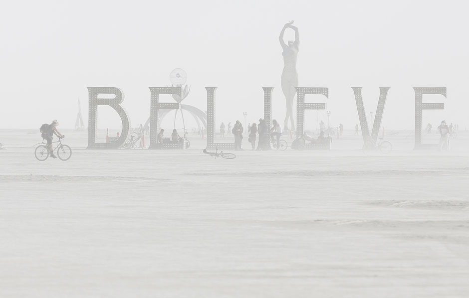 Dust envelops art installation during the Burning Man 2013 arts and music festival in the Black Rock Desert of Nevada