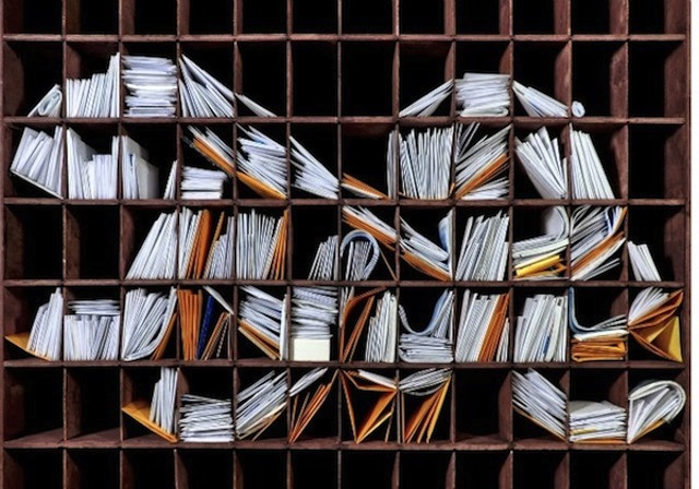 NY Times Logo with Stacks of Mail5