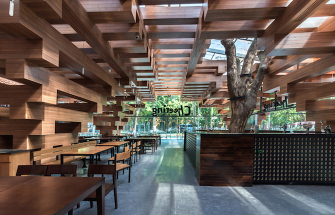 A Restaurant with Trees Inside in Hanoi