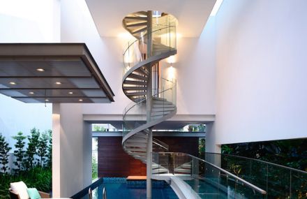 Spiral Staircase Above a Pool in a Singaporean Home