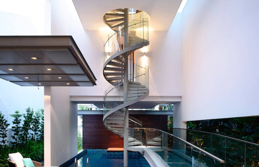 Spiral Staircase Above a Pool in a Singaporean Home