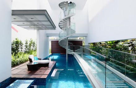 Spiral Staircase Above a Pool in a Singaporean Home