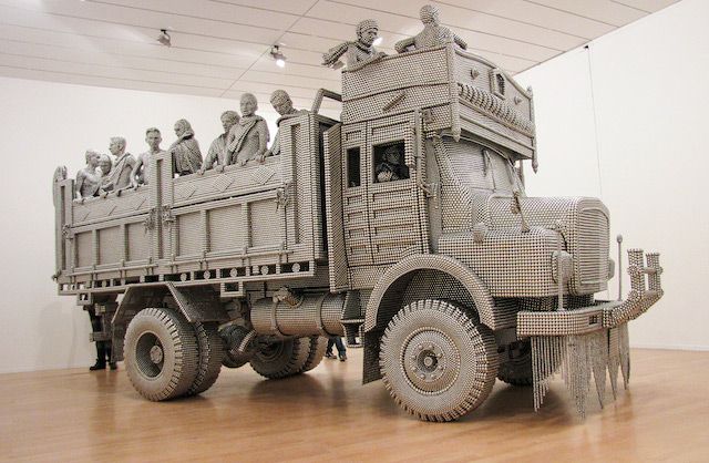 A Truck Sculpture Made of Reflective Steel Disks