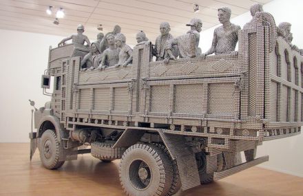 A Truck Sculpture Made of Reflective Steel Disks