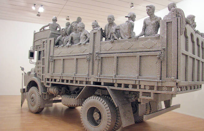 A Truck Sculpture Made of Reflective Steel Disks